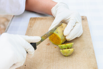 Peeling prickly pear fruit