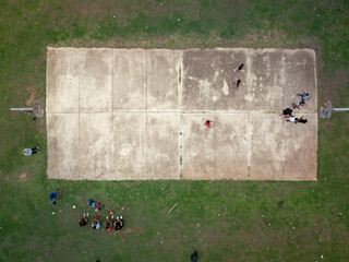 Aerial view of group of guys playing basketball