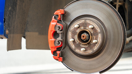 Close-up of a red sports brake caliper