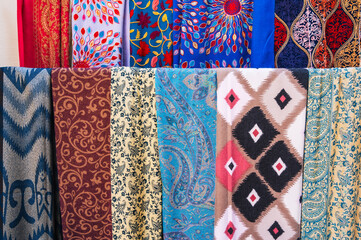 Traditional Arab Turkish scarves with a bright colorful pattern at the oriental bazaar in Turkey in...