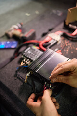 Technician installing the car audio processor Car audio installation concept.