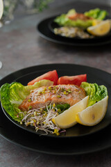 baaked salmon with accompaniments. 