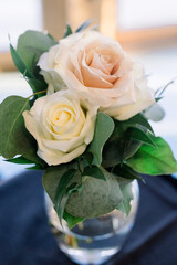 A simple floral arrangement with pink and white flowers in a vase