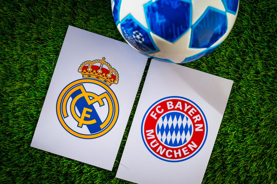 Real Madrid (ESP) vs Bayern Munich (GER). Semifinals of football UEFA Champions League 2024 in Europe. Logo of teams and official soccer ball on green grass