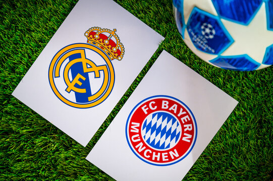 Real Madrid (ESP) vs Bayern Munich (GER). Semifinals of football UEFA Champions League 2024 in Europe. Logo of teams and official soccer ball on green grass