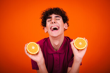 Funny young guy on a diet. A man posing in the studio.