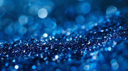 Sapphire-blue glitter dances with elegance amidst a blurred setting, conjuring visions of deep ocean waters and boundless serenity. - obrazy, fototapety, plakaty