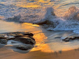 Sunset Serenade: Waves Caress Golden Sands