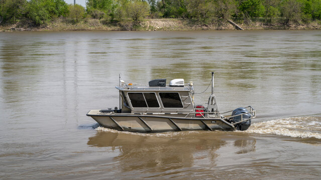Waverly, MO, USA - April 22, 2024: Aluminum working boat by Munson on the Missouri River.