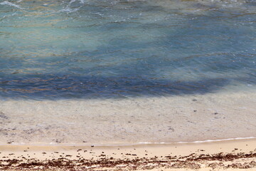 The color of water in the Mediterranean Sea in shallow water. Natural abstract background.