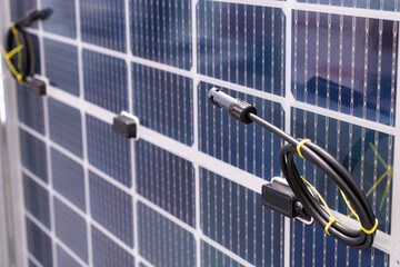 Close up solar panel with connecting cable.