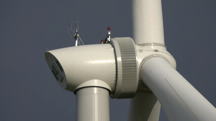 Windmill or wind turbine closeup in rotation