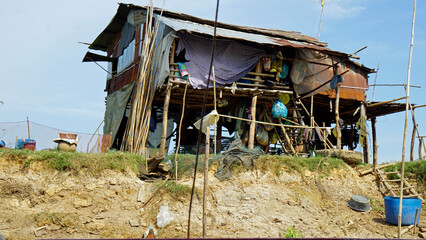 poor fisherman village at the shore of tonle sap river in cambodia