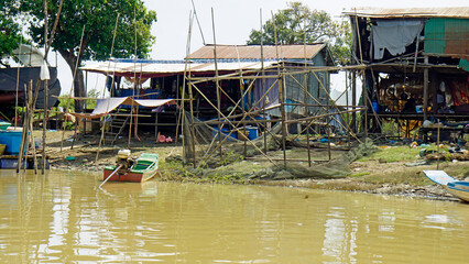 poor fisherman village at the shore of tonle sap river in cambodia