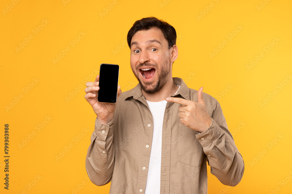 Poster man holding cell phone with empty black screen