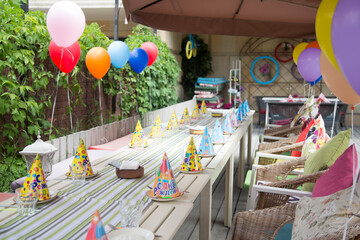 Table with colored balloons for children's birthday