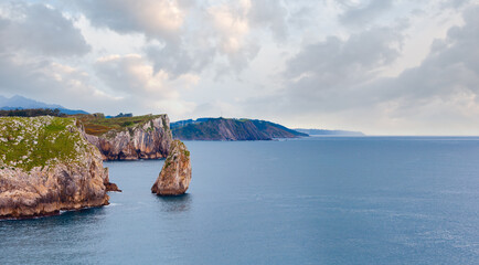 Bay of Biscay summer rocky coast view with rock island, Spain, Asturias, near Camango. Two shots...