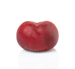 one whole plum fruit isolated on white background. clipping path included.