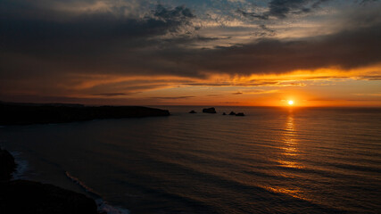 beautiful landscape of a sunset over the sea and cliffs