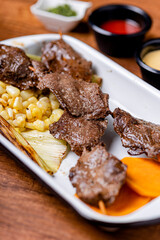 Peruvian anticuchos, juicy and seasoned, fresh from the grill.