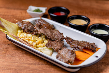 Peruvian anticuchos, juicy and seasoned, fresh from the grill.