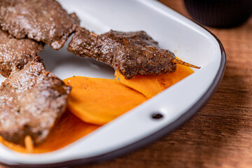 Peruvian anticuchos, juicy and seasoned, fresh from the grill.
