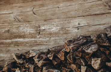Chopped firewood pile. Woodpile board wall. Wood. Old dry pine wooden heap. Brown color textured...