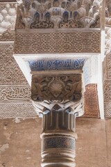 A pillar with blue and white designs on it