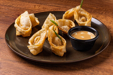Tequeños stuffed with lomo saltado with guacamole sauce