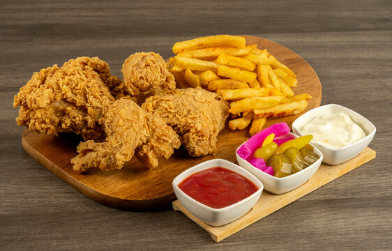 Broasted fried chicken meal with french fries and appetizers

