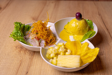 Peruvian food, seafood trio. on wooden table.