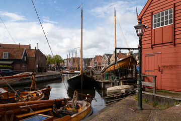 Old harbor with wooden boats in the picturesque fishing village of Spakenburg.