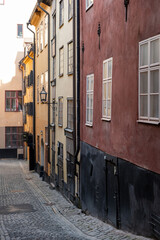 Stockholm Sweden, traditional building with lantern, narrow alley, Gamla Stan Old Town. Vertical