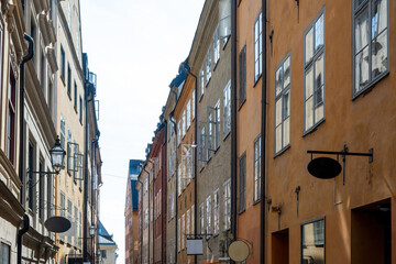 Sweden, vintage building in Stockholm, Gamla Stan. Metal empty hanging signboard over store Old Town