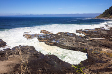 Pacific coastal waters and blue sky of the central Oregon coast, USA