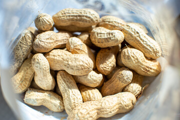 top view of bag of raw peanuts on table