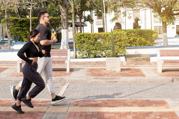 lifestyle: young sportsman couple jogging together