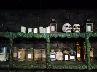 Quest room of horrors. Shelves of horror room with candles, jars and sculls layouts. - 799367781