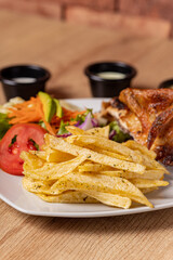 Peruvian grilled chicken, with fries and salad.