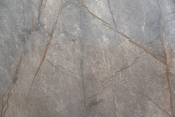 Gray marble quartzite countertop background with golden veins
