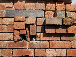 Random pile of old red building bricks