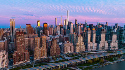 Skyline of New York at the waterfront of the East River in New York, the USA. Drone approaching the...