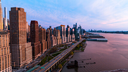 Skyline of New York at the waterfront of the East River in New York, the USA. Drone approaching the...