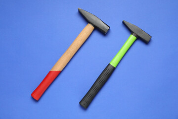 New hammers on blue background, top view