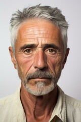 Portrait of a man with grey hair and beard