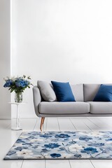 Patterned carpet in front of grey couch with blue pillows in white loft interior with flowers Real photo
