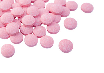 Heap of pink tablets isolated on a transparent background. Close up. Stock photo.