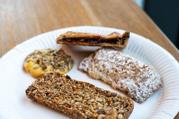 Sweet cookies with cereals, wheat, sunflower seeds, flax seed, oats and powdered sugar glazing, Poland