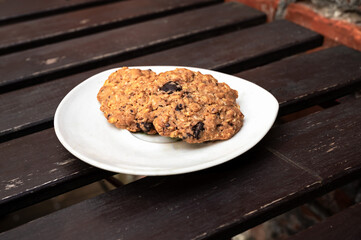 Chocolate chunk coockie on a brown wooden table, Belgium