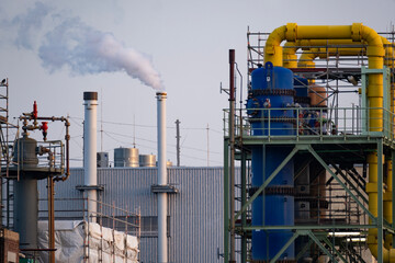modern petrochemical plant in Frankfurt, Germany, factory with steam coming out of chimney,...